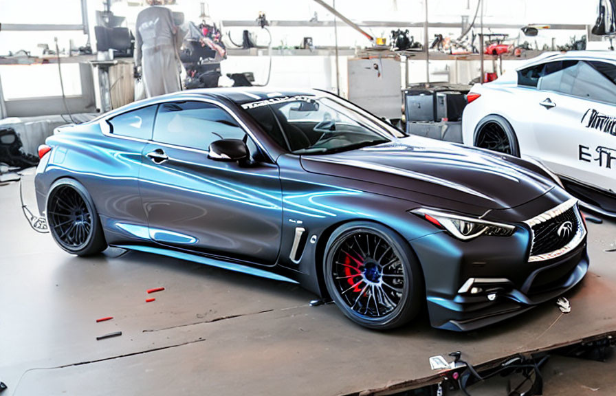 Metallic Gray Sports Coupe with Custom Blue Detailing and Aftermarket Wheels in Garage