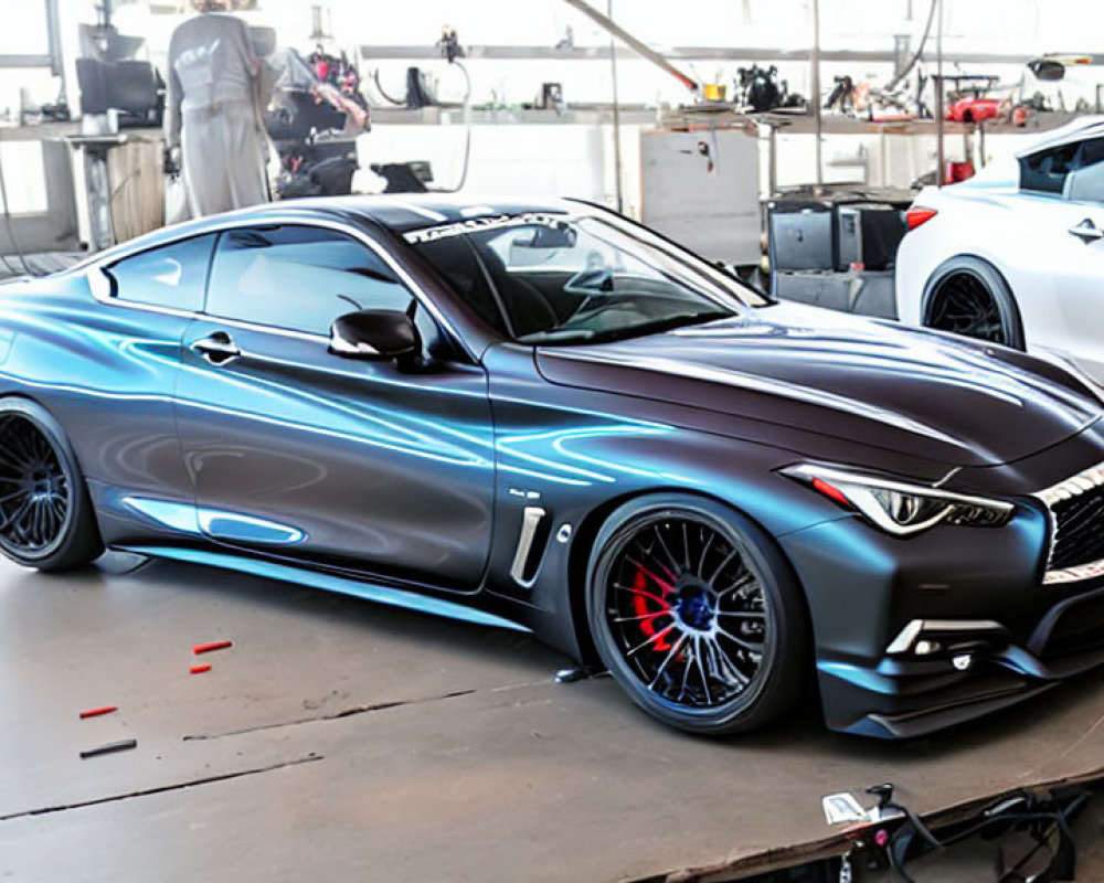 Metallic Gray Sports Coupe with Custom Blue Detailing and Aftermarket Wheels in Garage