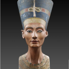 Elaborate ancient Egyptian headdress with cobra and ornate collar on person