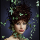 Woman with Leaf-Adorned Hair & Green Eyes on Dark Floral Background