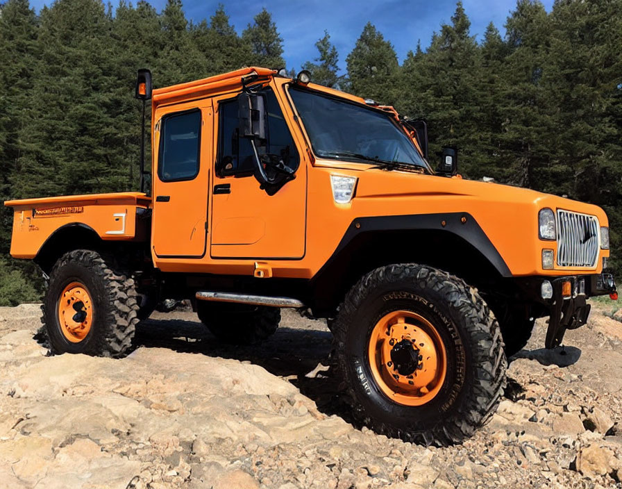 Off-road utility vehicle on rocky terrain with large tires