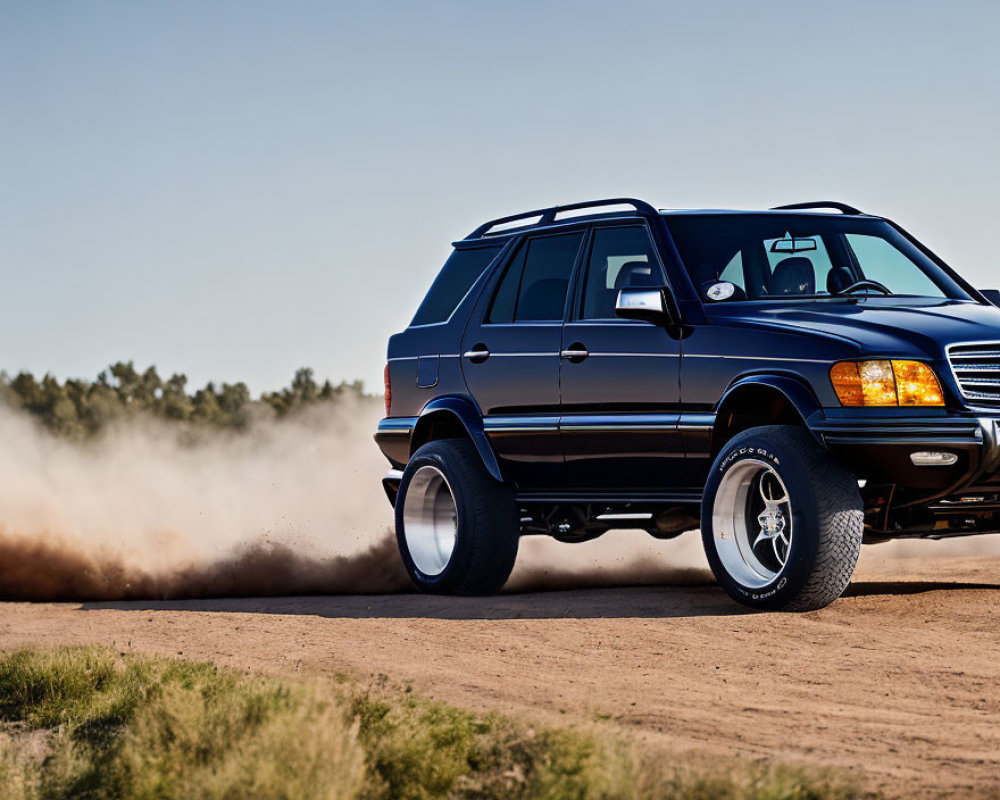 Black SUV on Dirt Road Creating Dust Trail Under Blue Sky