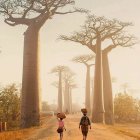 Person walking with umbrella in fantastical landscape with towering tree-like structures, dandelion-like canopy tops