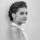 Monochrome portrait of woman in updo and backless dress