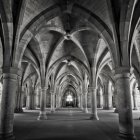 Colorful art installations in cathedral interior with visitors on pews