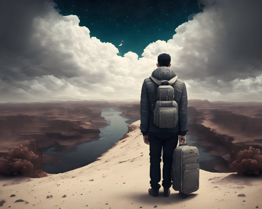 Person overlooking surreal landscape with water channels on sandy rise