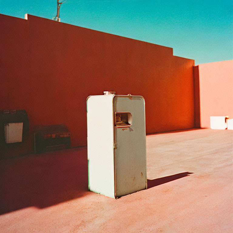 Vintage Refrigerator in Open Area with Pinkish-Red Decor