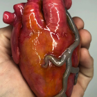 Detailed Mechanical Heart Held by Human Hand Against Futuristic Background