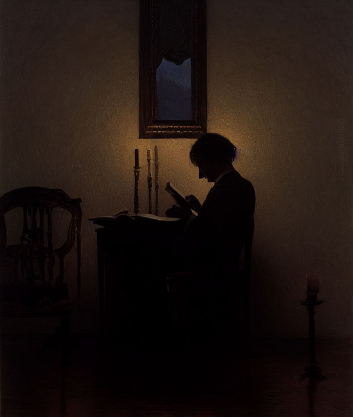 Silhouetted figure reading by candlelight in dark room