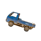 Blue Vintage Pickup Truck on Dusty Road with Graphics