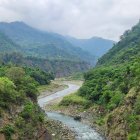 Scenic Valley with River, Waterfalls, Greenery, Bridges & Ancient Structures