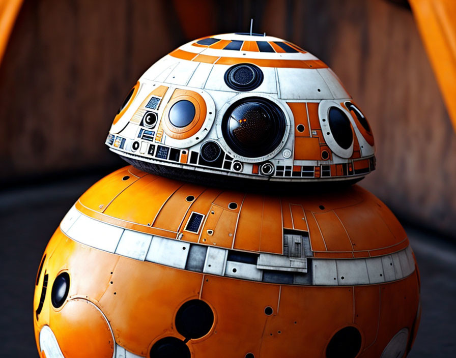 Spherical orange and white droid from Star Wars on orange backdrop