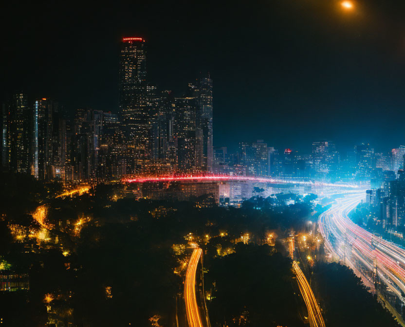 Vibrant nighttime cityscape with busy highway and skyscrapers