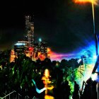 Vibrant nighttime cityscape with busy highway and skyscrapers