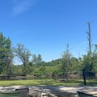 Tranquil Lake Scene with Red and Blue Canoes