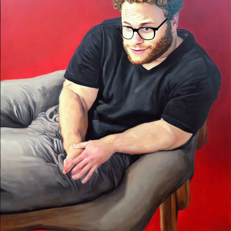 Curly-Haired Man in Glasses on Grey Armchair Against Red Background