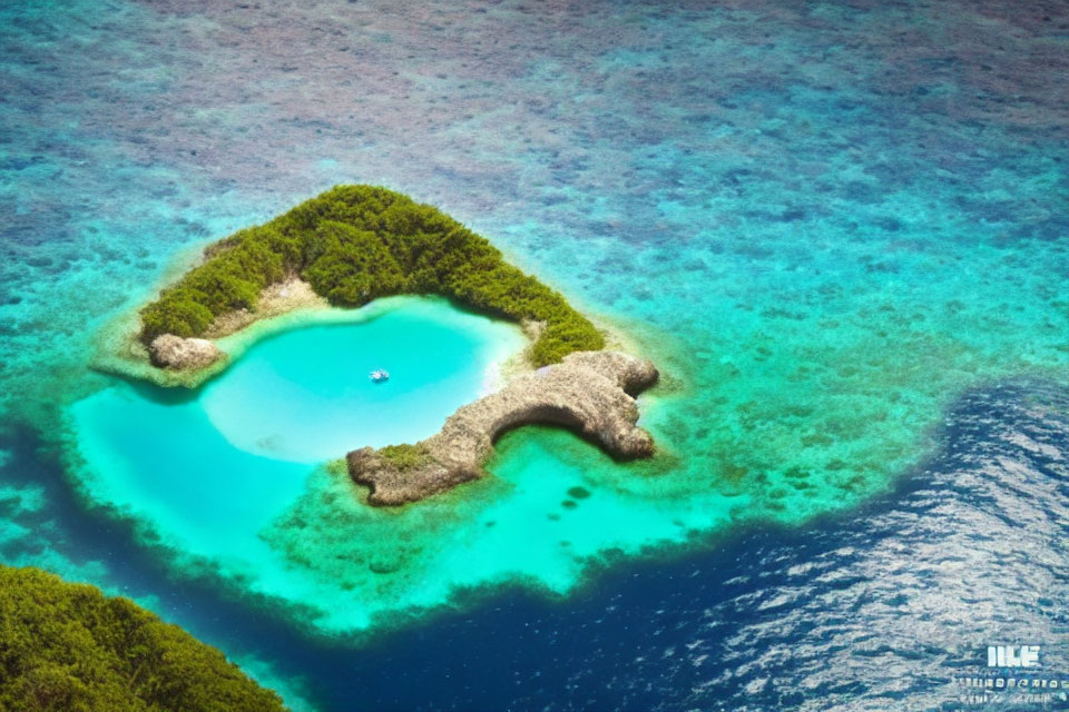 Heart-shaped island with lush greenery in vibrant turquoise waters