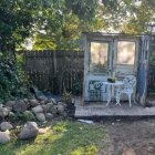 Lush Foliage and Vibrant Flowers Adorn Garden Shed