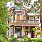 Victorian-style house in enchanted forest with purple walls and peacock.