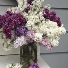 Colorful Bouquet Painting with Lilac Blossoms and White Roses on Grey Background