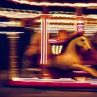 Carousel Horse Photo with Motion Blur and Bright Lights