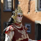 Elaborate Gold and White Venetian Mask and Costume in Gondola