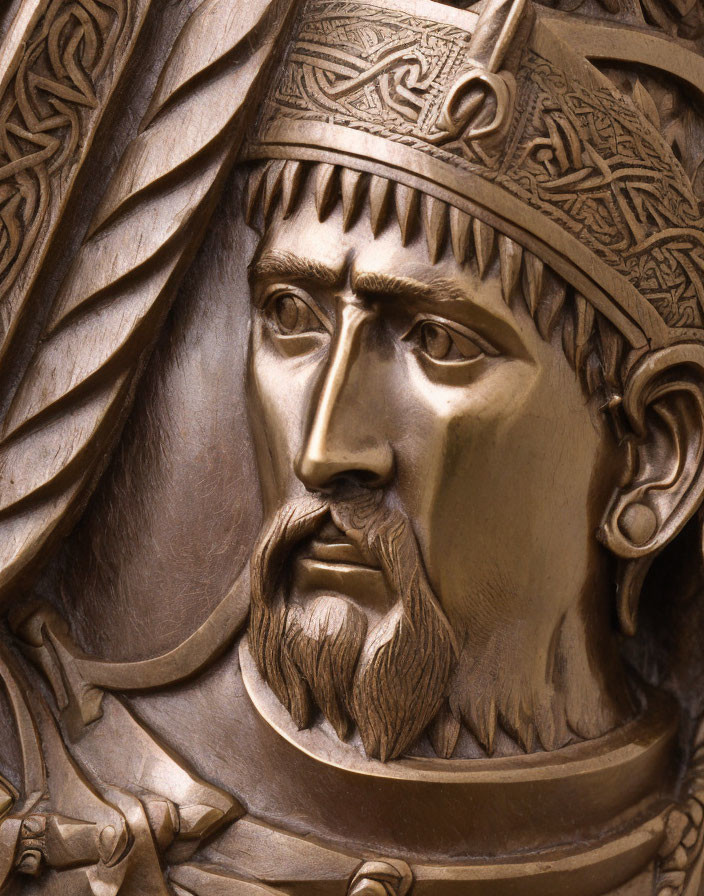 Bronze bas-relief of a medieval king with detailed crown and armor