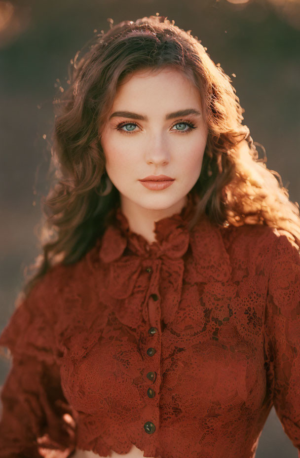 Portrait of Woman with Wavy Hair and Blue Eyes in Ruffled Lace Blouse