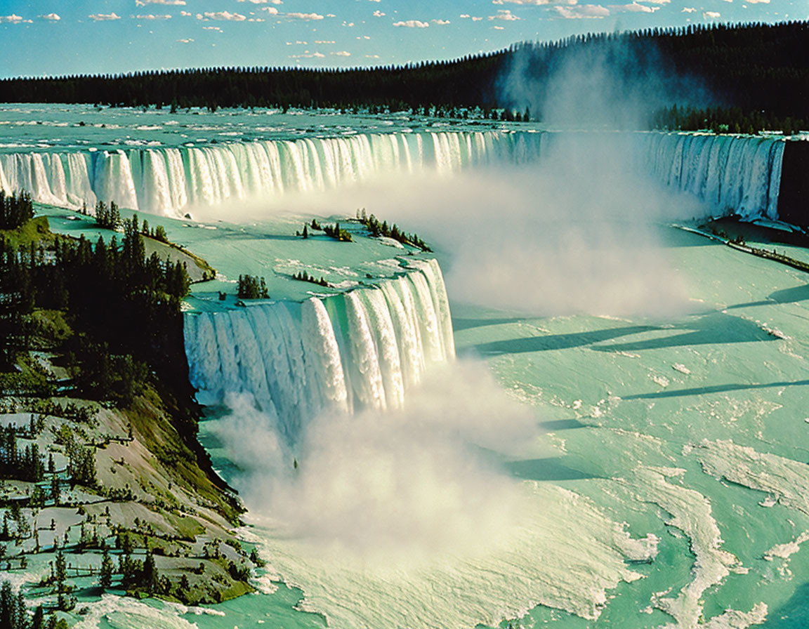 Majestic aerial view of a vast waterfall over frozen river