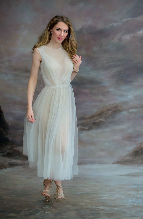 Elegant woman in white dress against cloudy backdrop