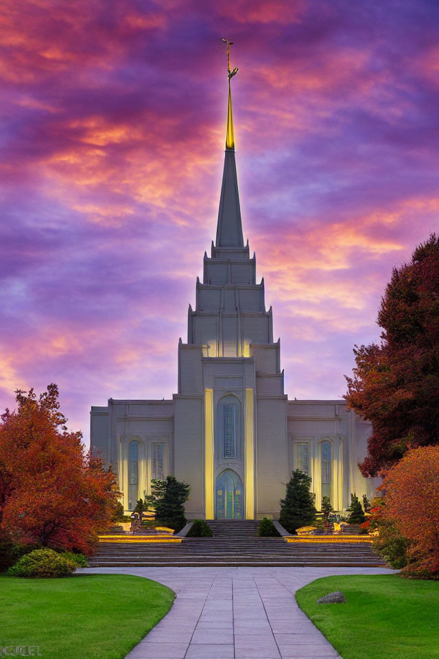 Majestic temple with tall spire in vibrant sunset setting