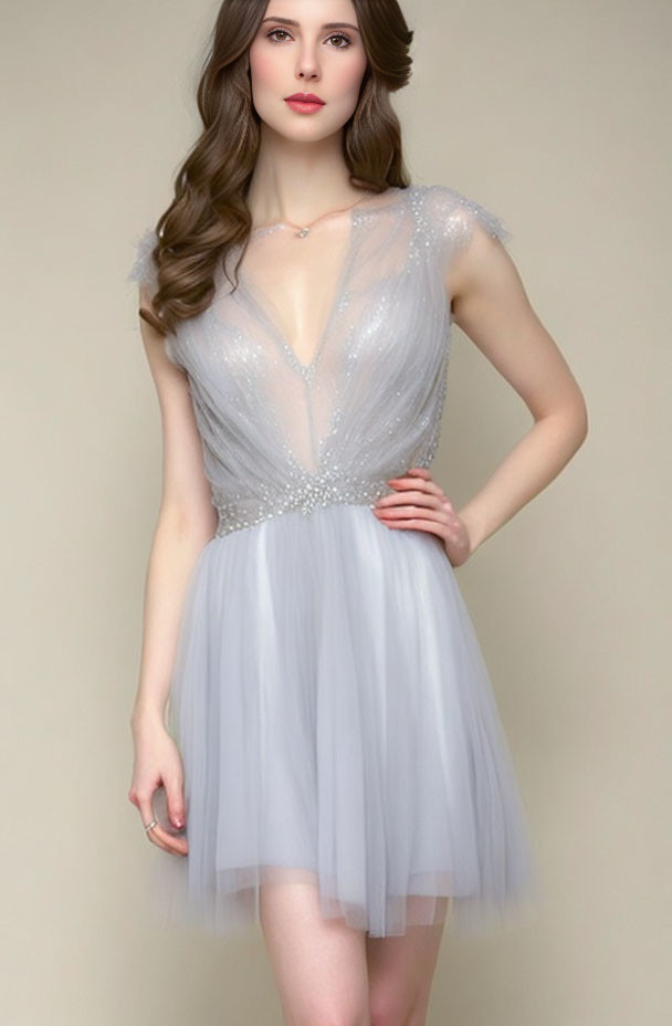 Elegant woman in gray tulle dress with sequined bodice