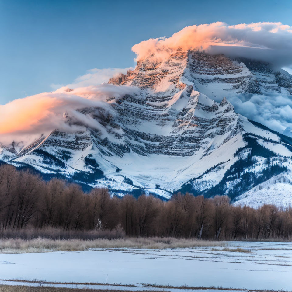 Snowy Mountain Sunset with Swirling Clouds and Winter Landscape