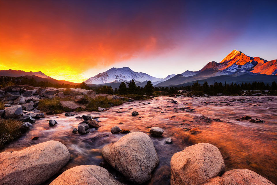 Vibrant sunrise over mountain range and river landscape