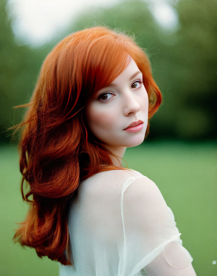 Long Red-Haired Woman with Fair Skin in Subtle Pose