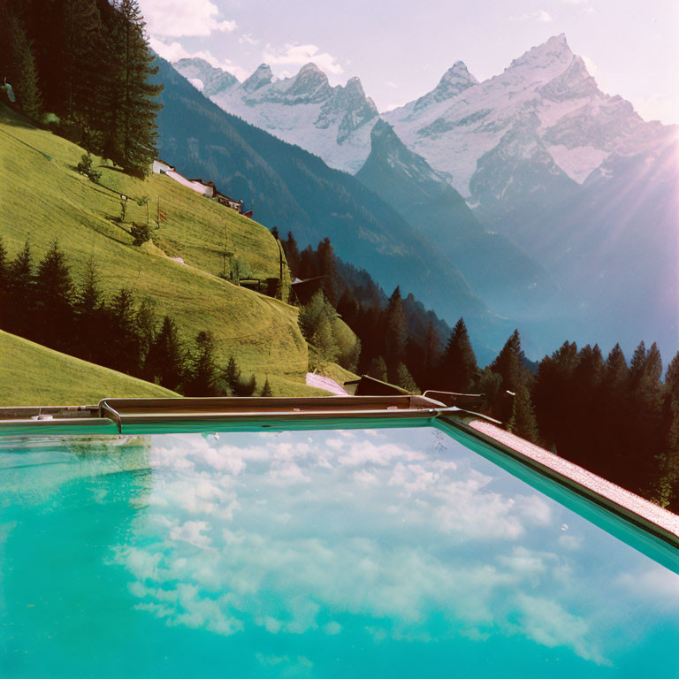 Scenic infinity pool with reflective blue water and mountain view