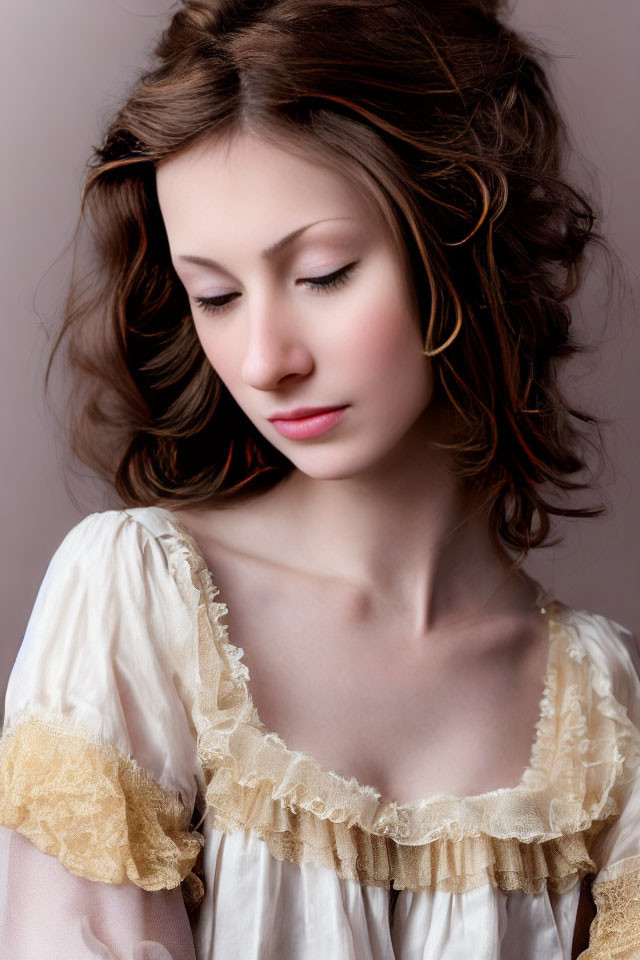 Curly Haired Woman in Vintage Cream Dress on Muted Background