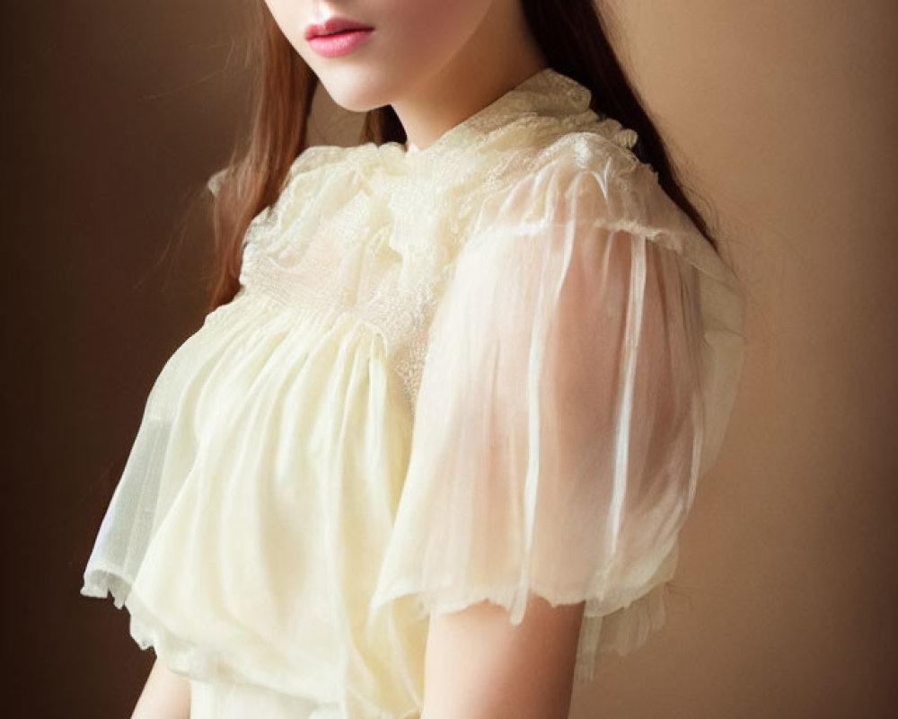 Young woman in vintage attire with subtle smile on warm-toned background