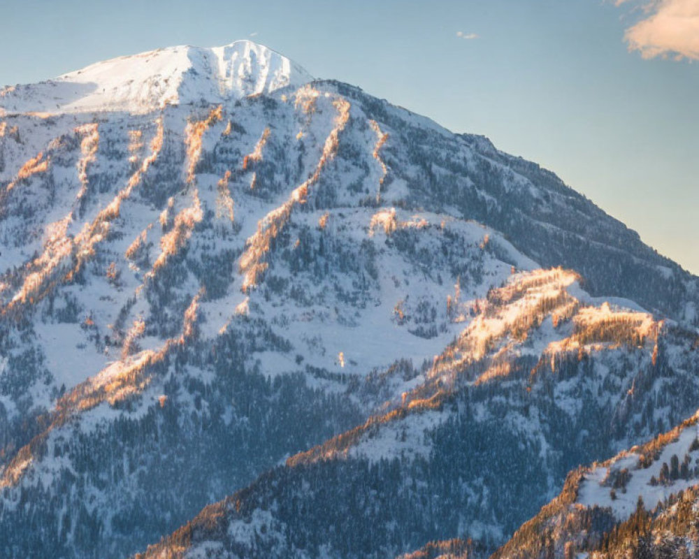 Majestic snow-covered mountain landscape under clear blue sky