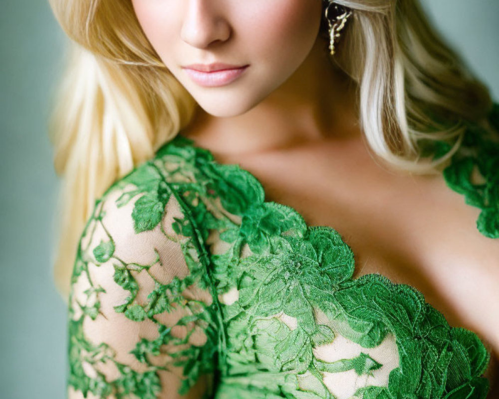 Blonde Woman in Green Lace Dress with Blue Eyes