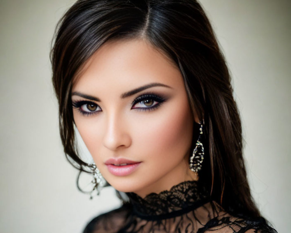 Dark-haired woman in bold makeup and lace attire gazes at camera