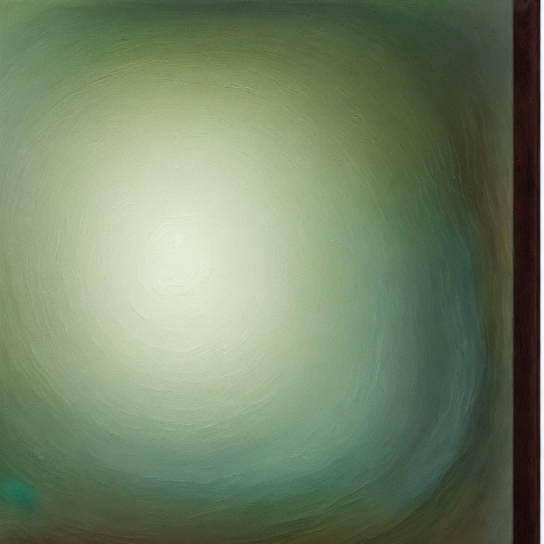 Blurred abstract image with green and cream swirls