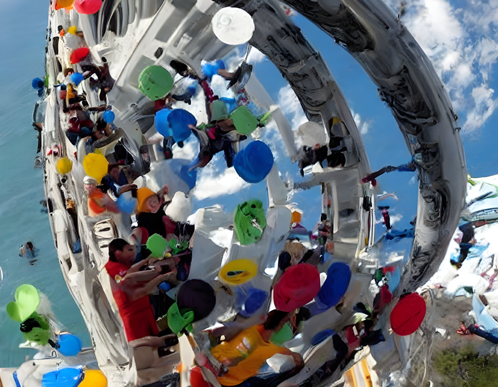 Colorful hats and balloons on a boat under a clear sky