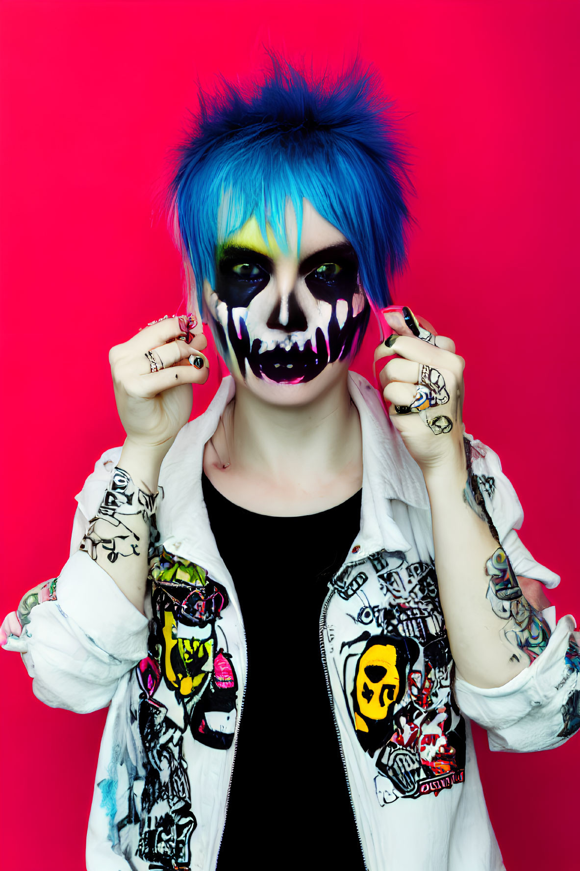 Blue-haired person with skull makeup in white jacket on pink background