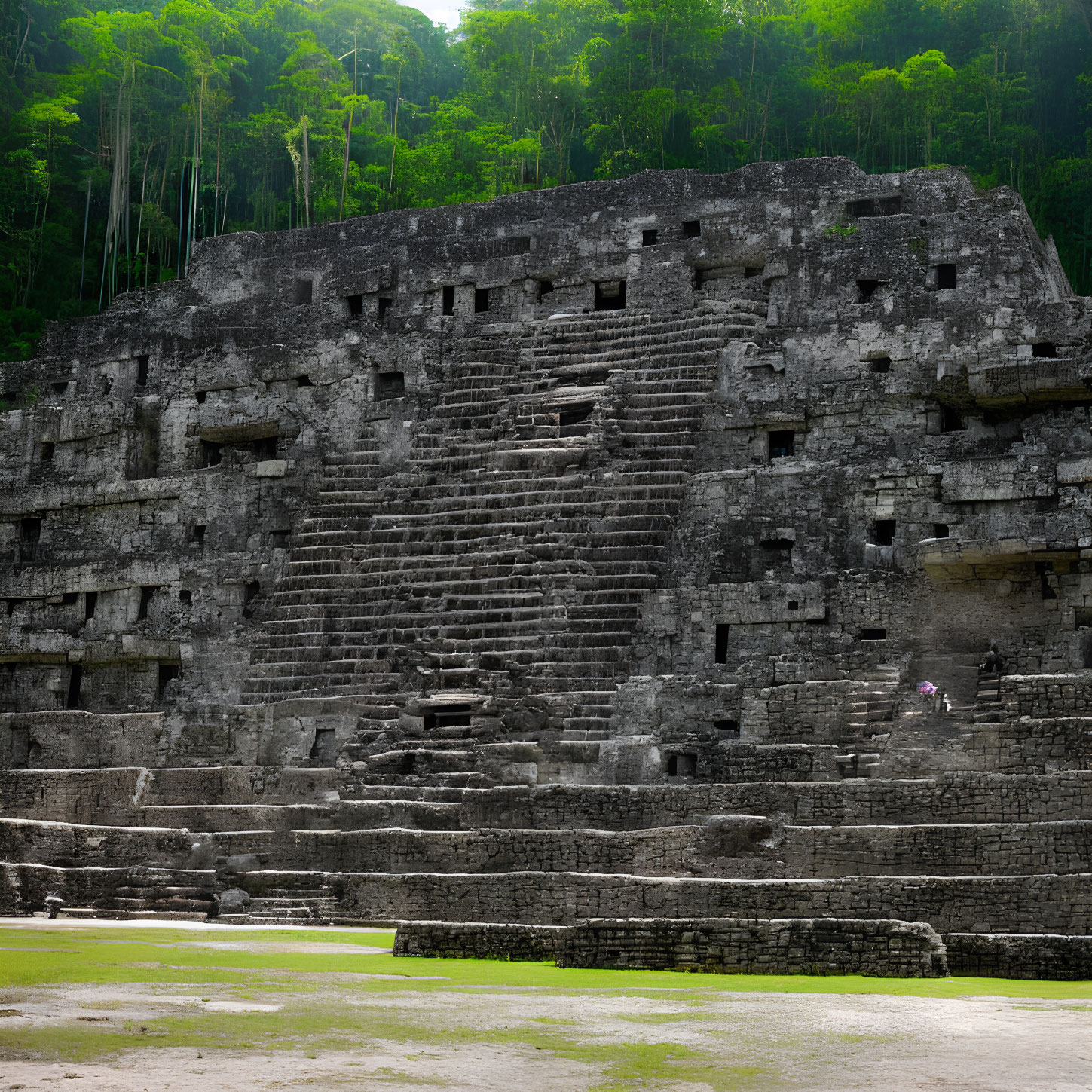 Ancient Mesoamerican Pyramid Surrounded by Green Forest