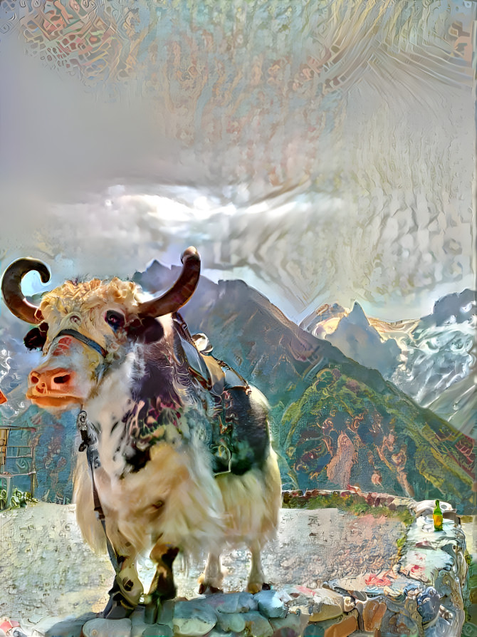 A cow and mountains