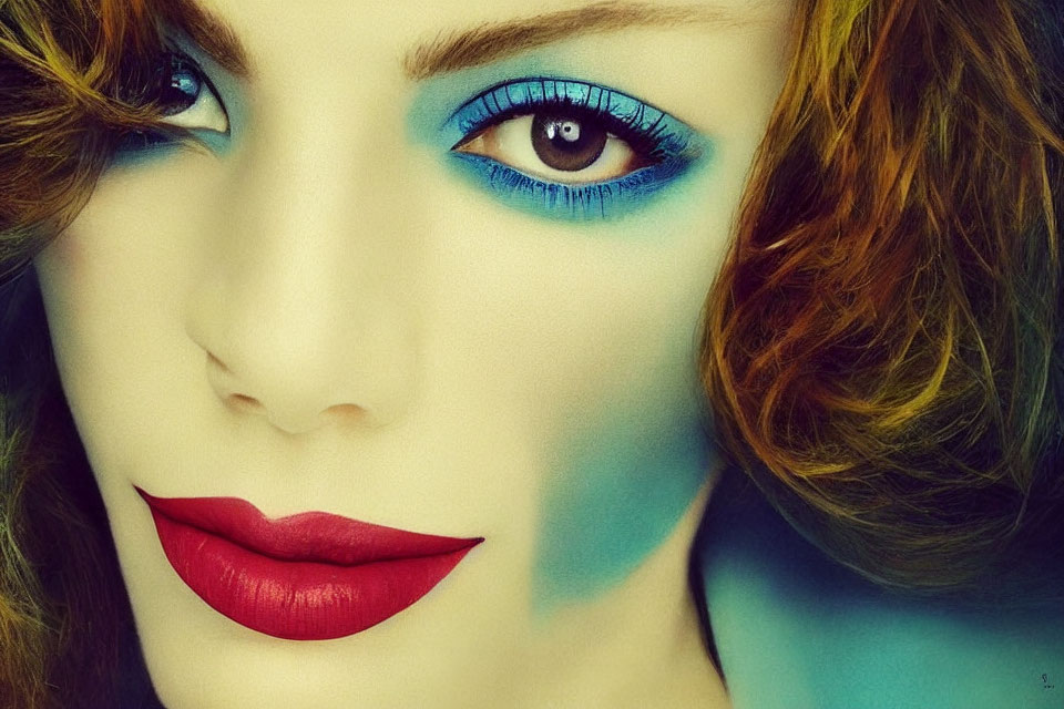 Close-Up Portrait of Woman with Blue Eyeshadow, Auburn Hair, and Red Lips