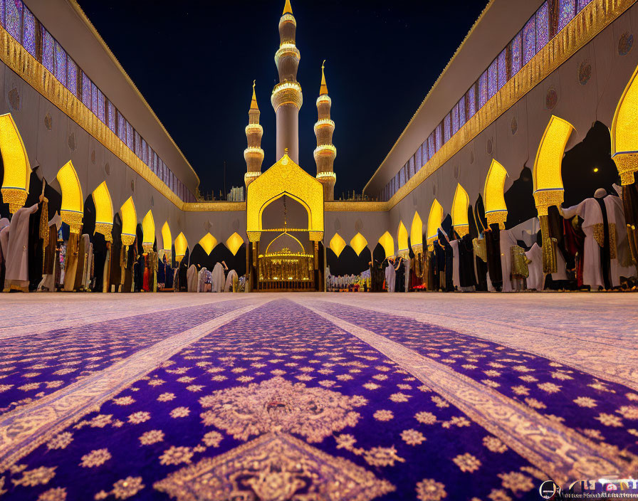 Mosque interior during prayer time with worshippers on patterned carpet