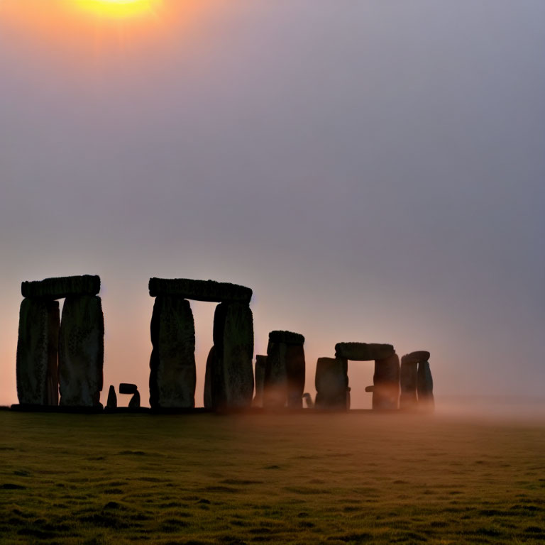 Ancient Stonehenge Silhouettes in Misty Sunrise or Sunset