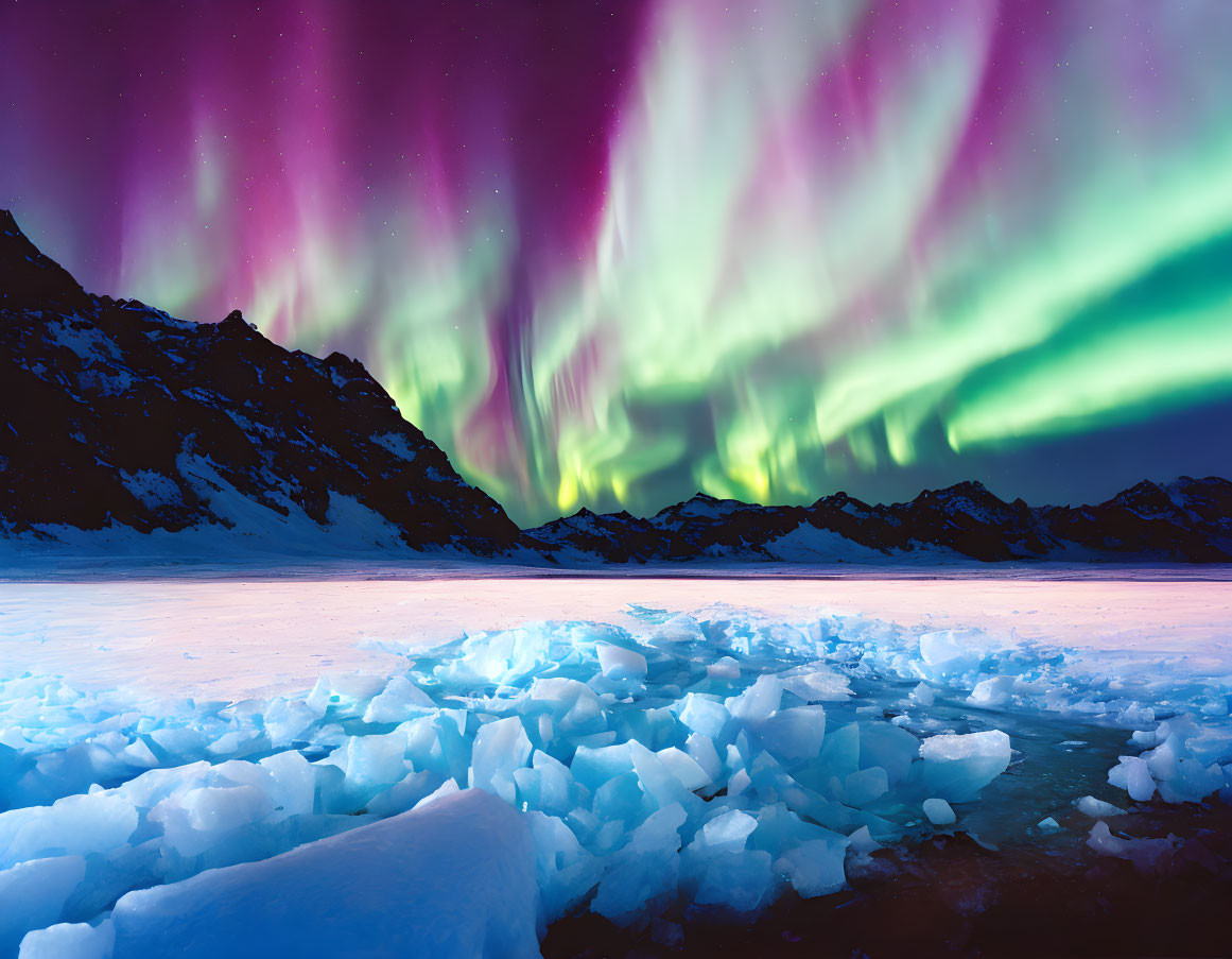 Northern Lights illuminate snowy landscape with broken ice and mountain silhouettes